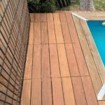 Platelage bois et margelles de la piscine après travaux à Castelnau-d'Estrétefonds